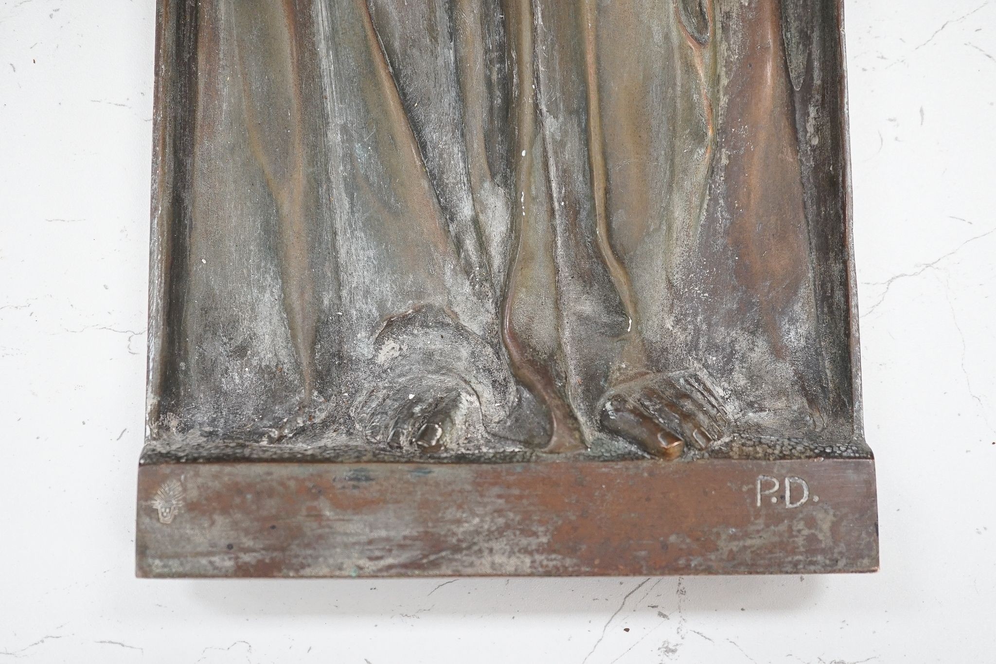 A cast bronze angel, initialled ‘P.D’ to bottom right, 72cm